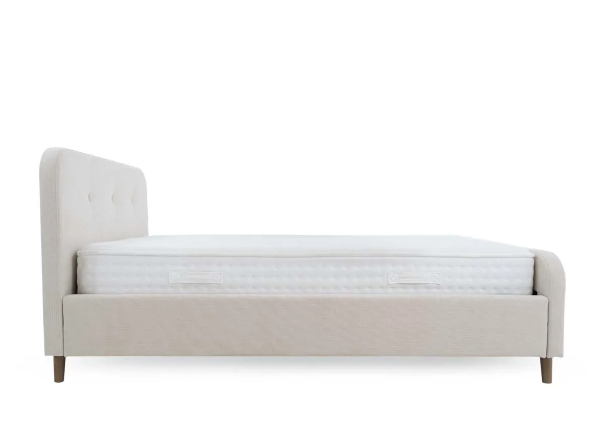 A cream 4ft6 bedframe from EZ Livings Serena range. Side view of cream upholstery on sides