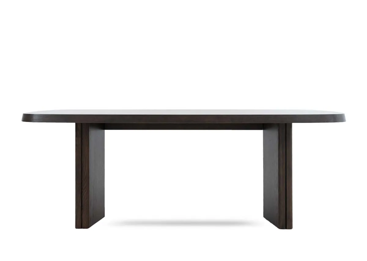 A dark brown wood dining table from EZ Livings Natu range.Front view of thick table top