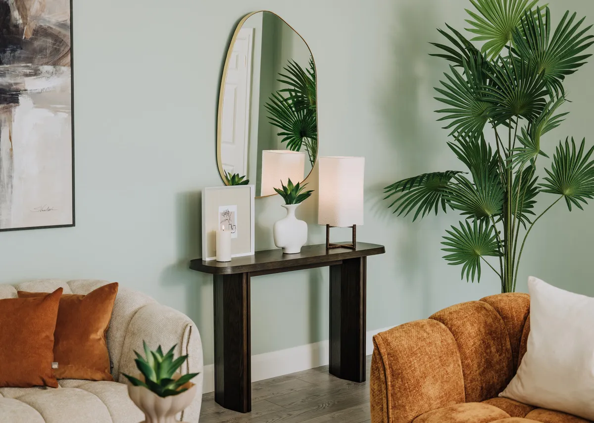 A lifestyle image of the Natu console table with colson mirror and Matera sofa range.