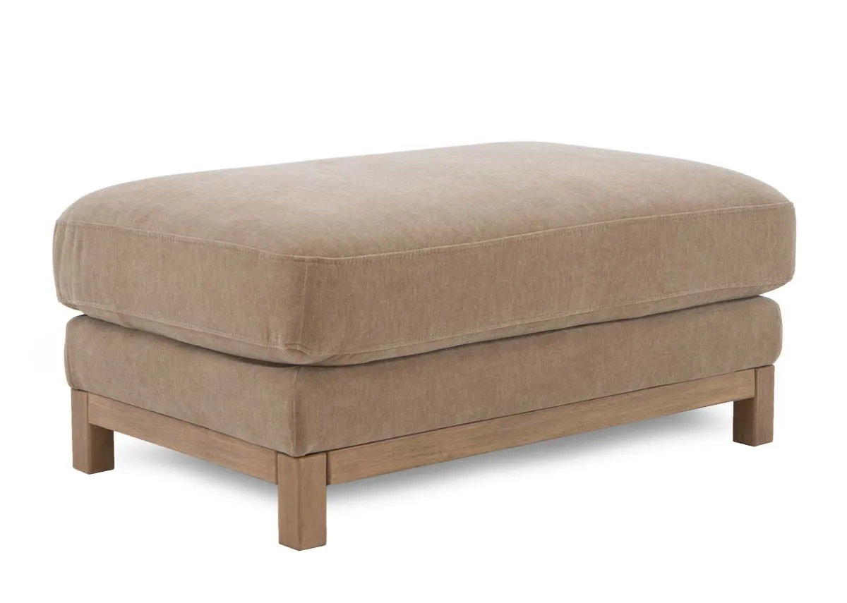 A large mink footstool from EZ Livings Miller range. Angled view of thick foam seat and wood legs
