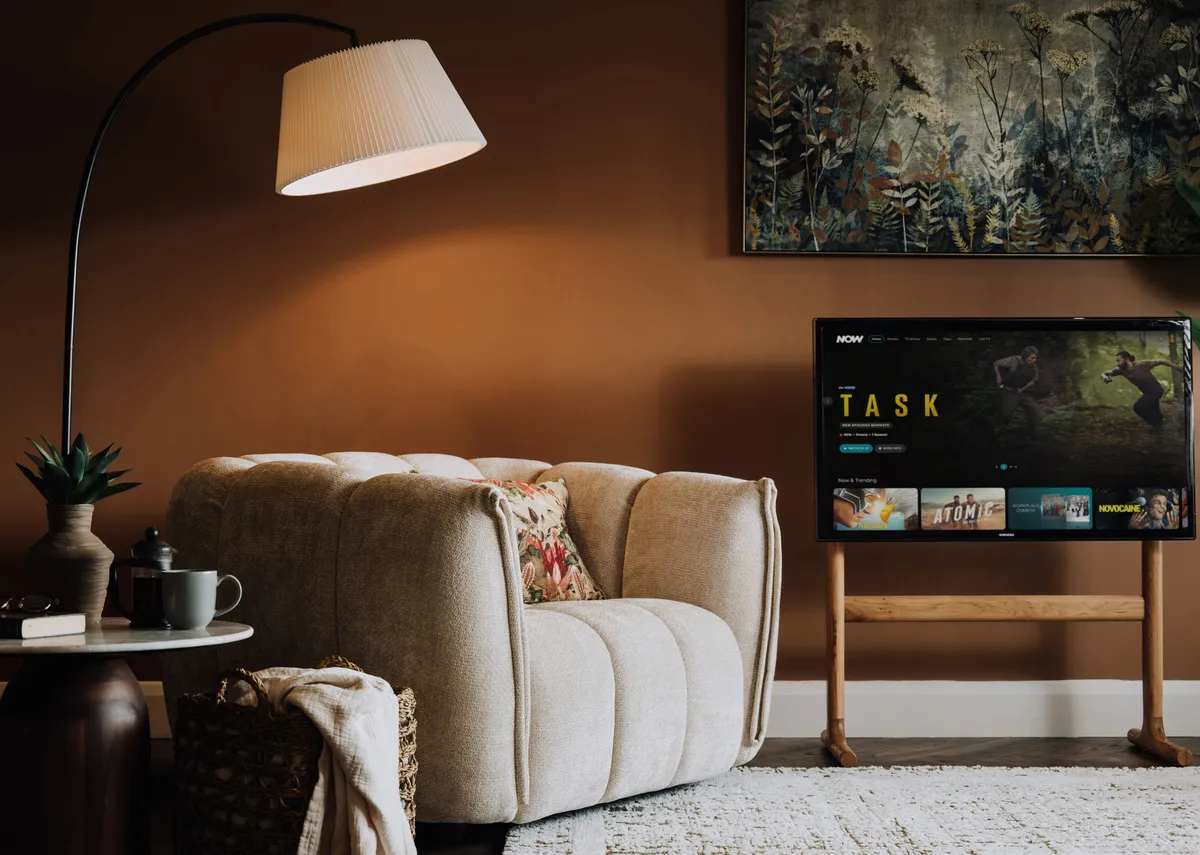 A lifestyle image of the Matera armchair with tv unit