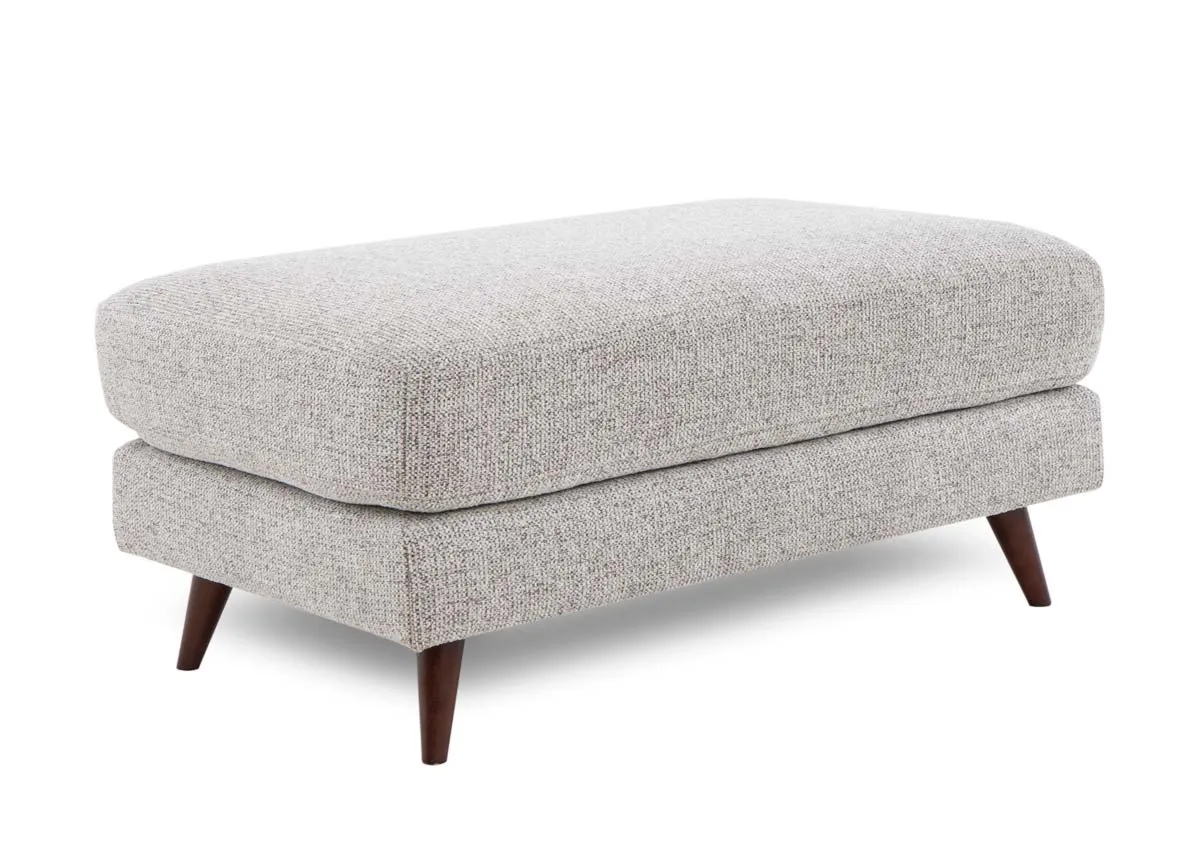 A rectangular footstool from EZ Livings Bailey range. Angled view of brown accent fabric