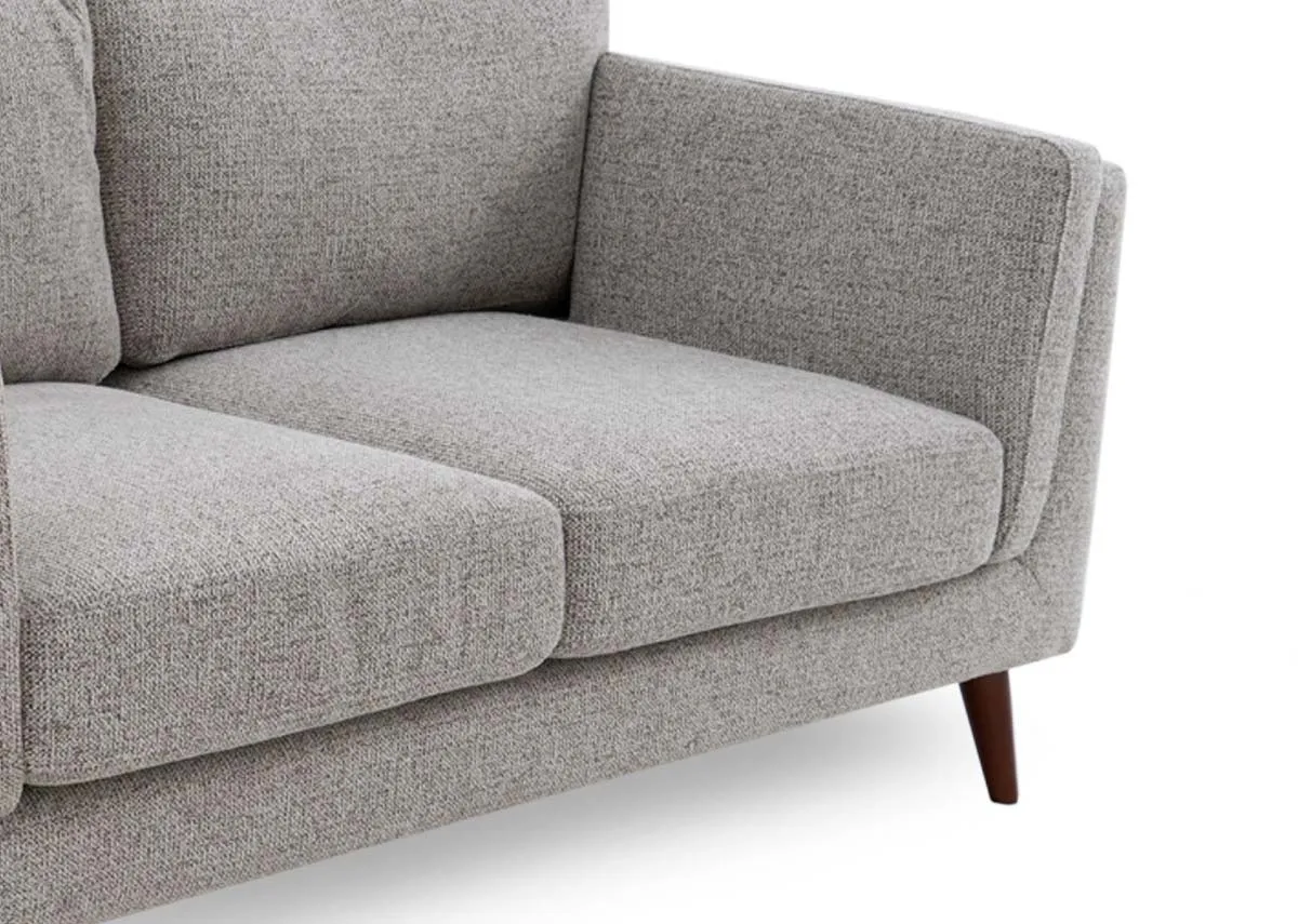 A light brown accent 2 seater sofa from EZ Livings Bailey range.Closeup of brown textured fabric