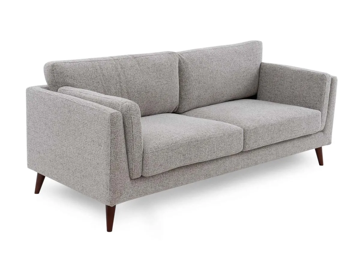 A light brown accent 3 seater sofa from EZ Livings Bailey range. Angled view of retro style sofa.