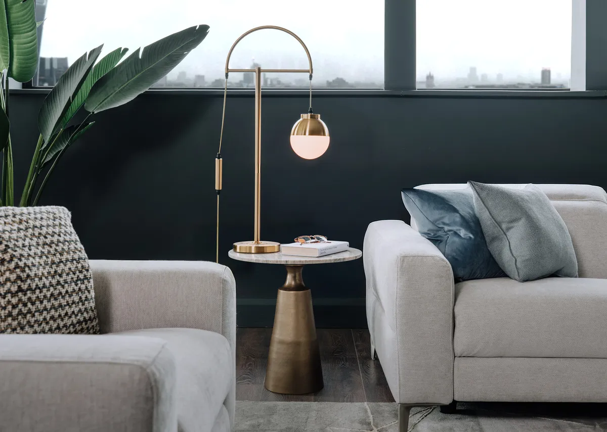 A lifestyle image of the Pyramid side table with Casper lamp and Vancouver sofa.