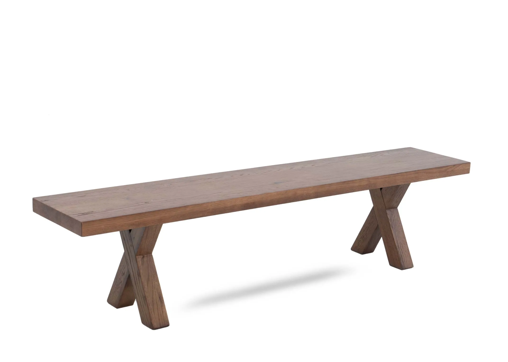 An all oak dining bench with x legs from EZ Livings Davos range. Angled view.