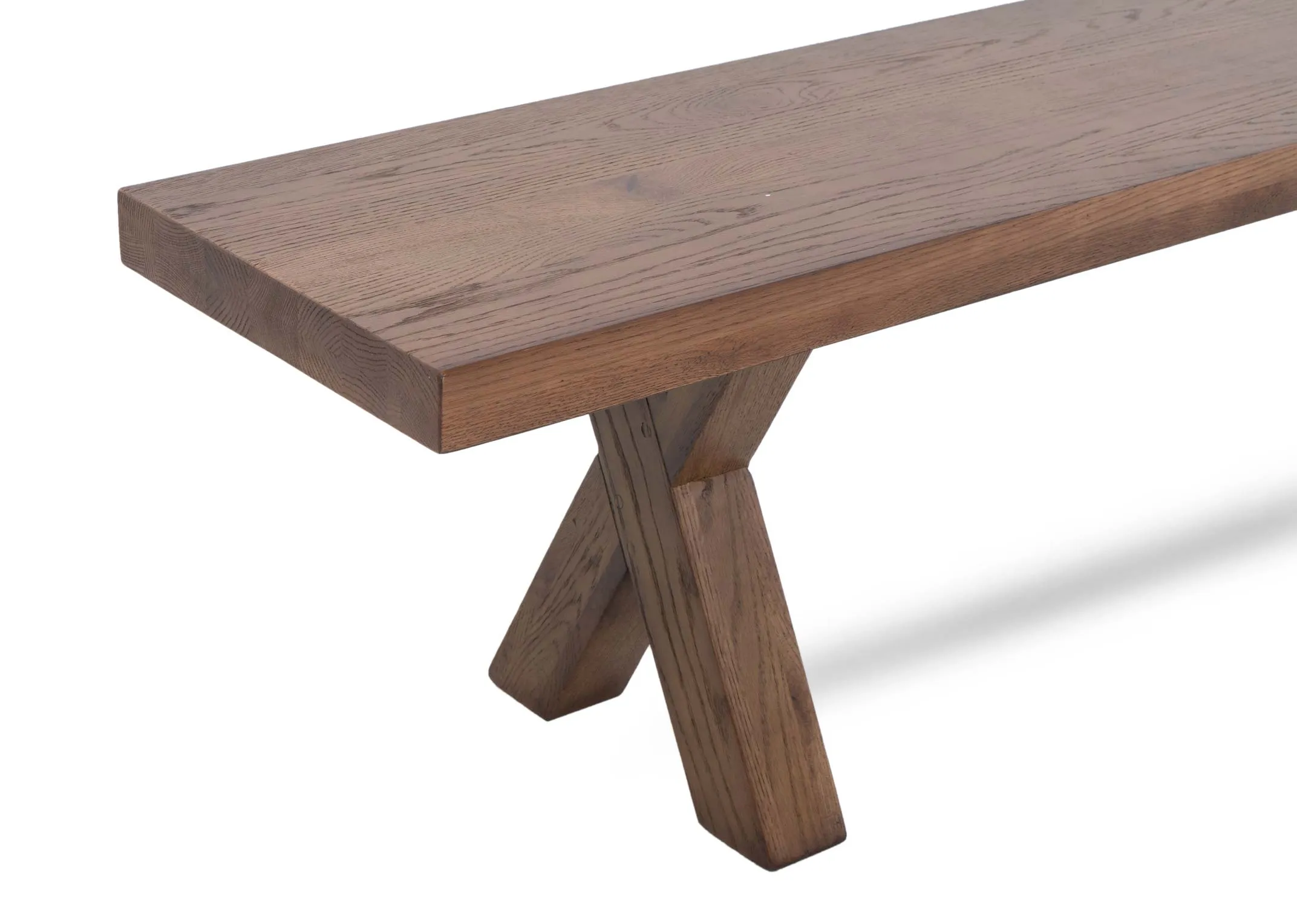 An all oak dining bench with x legs from EZ Livings Davos range.Closeup of thick wood top