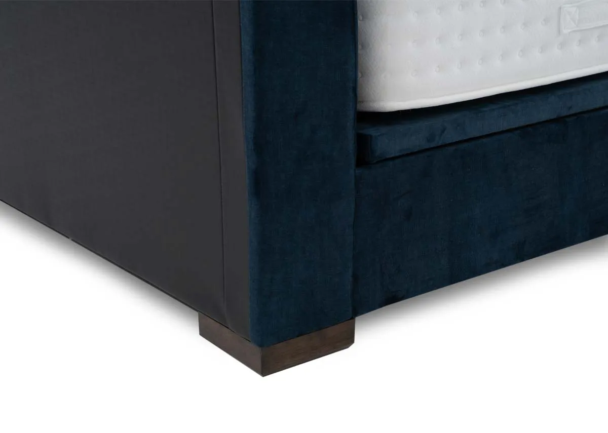 A 5ft ottoman bed in petrol blue from EZ Livings Lancelot range. Closeup of fabric finish.