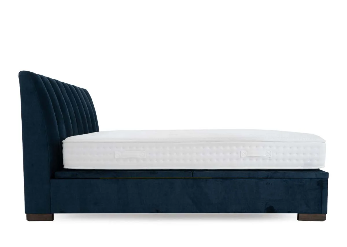 A 5ft ottoman bed in petrol blue from EZ Livings Lancelot range. Side view of upholstered finish on sides