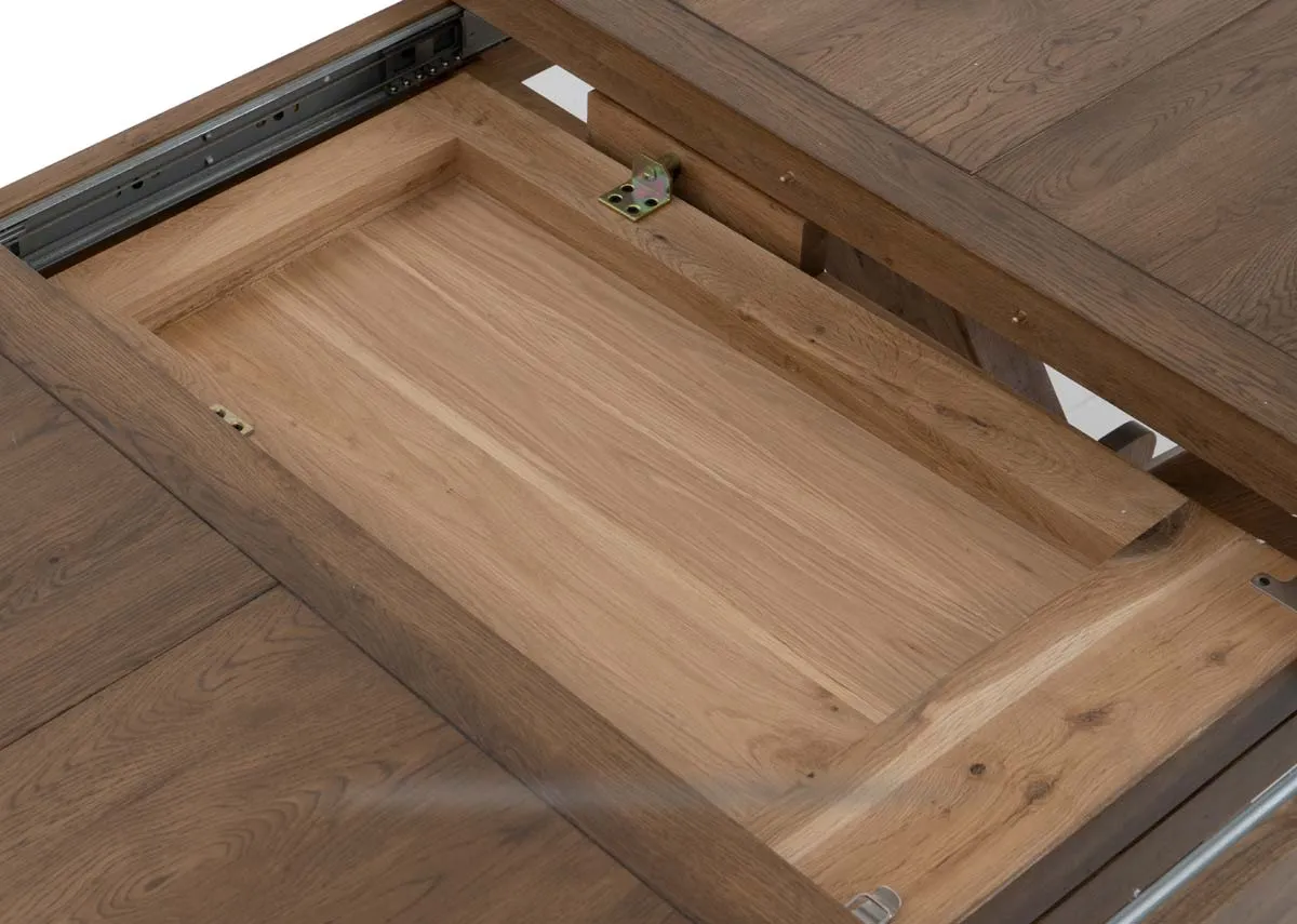 A round to oval dining table from EZ Livings Naxos range. Closeup of the extension leaf.