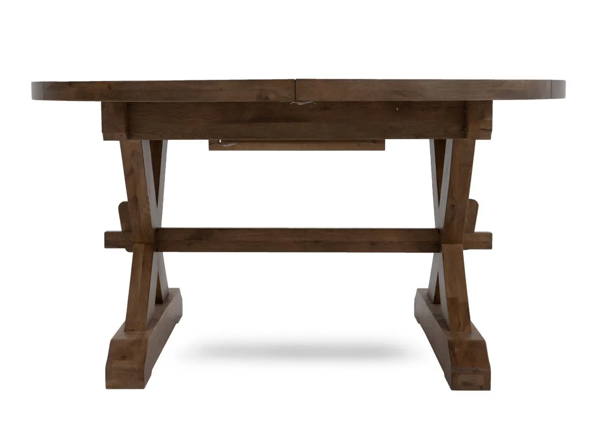 A round to oval dining table from EZ Livings Naxos range. Front view of table as round