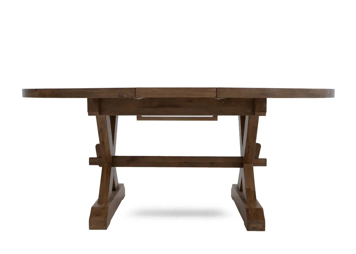 A round to oval dining table from EZ Livings Naxos range. Front view of table as oval.