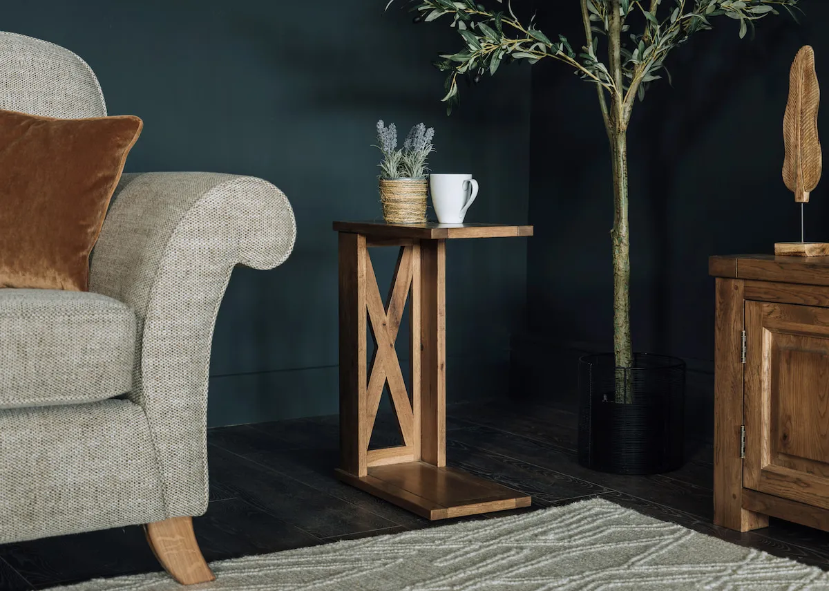 A lifestyle image of the Naxos sofa table with the Lauren fabric sofa with Kansas rug.