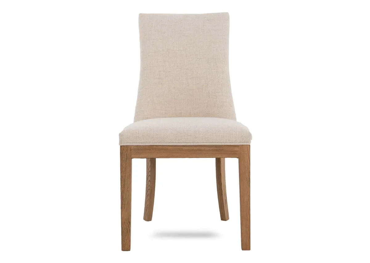 A cream fabric dining chair with oak frame from EZ Livings Becky range. Front view