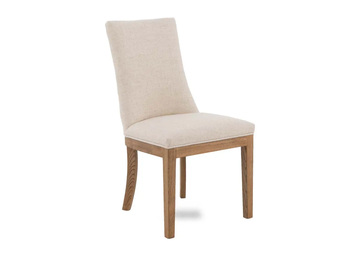 A cream fabric dining chair with oak frame from EZ Livings Becky range. Angled view.