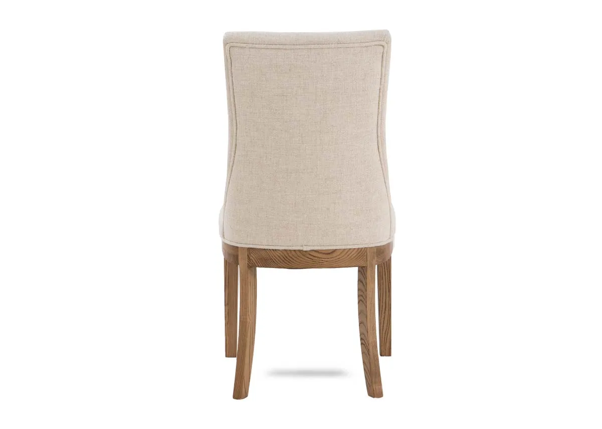 A cream fabric dining chair with oak frame from EZ Livings Becky range. Back view of fully upholstered chair