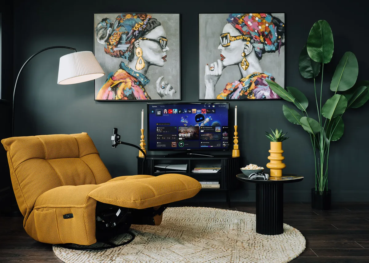 A lifestyle image of the Jave glider fulled reclined with Contessa prints and Arc floor lamp.