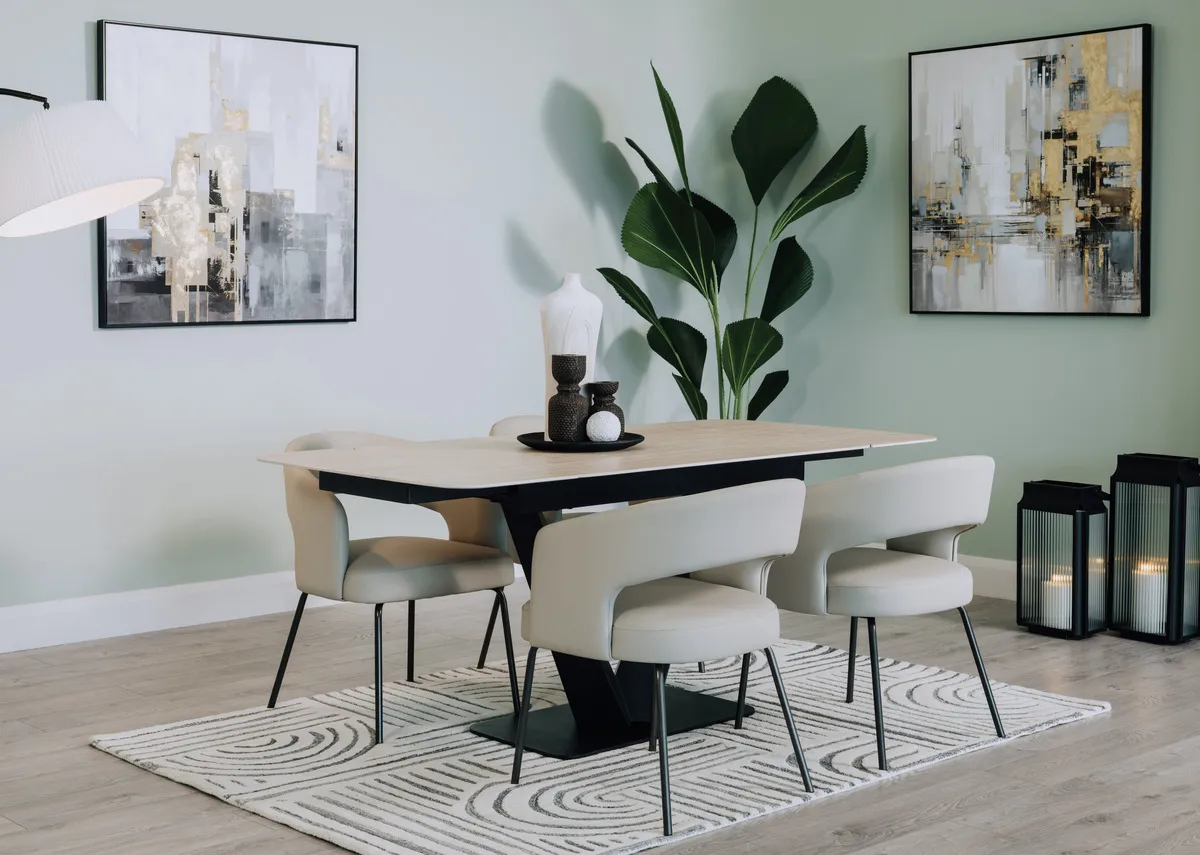 A lifestyle image of the Tuscan dining table extended with Matteo chairs and Lifted Canvas