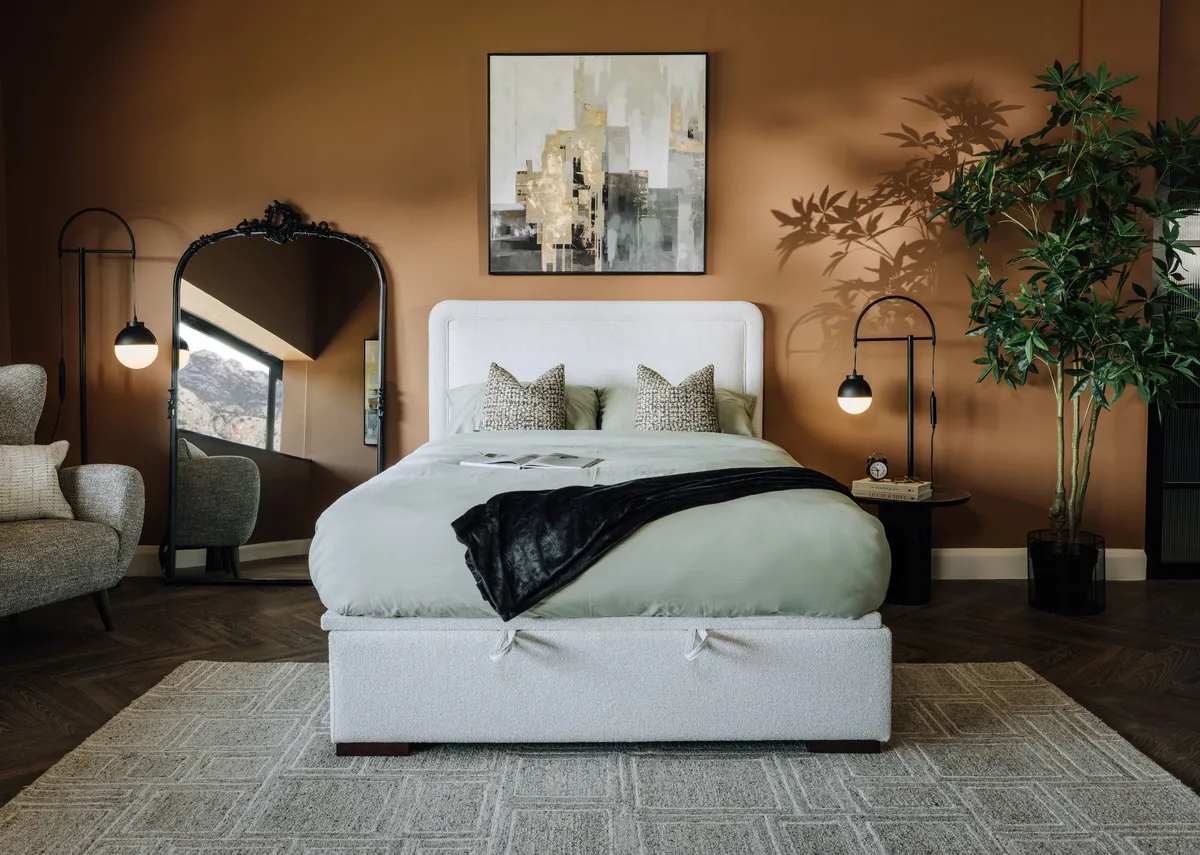 A lifestyle image of the Malmo bed with Kacey mirror and Lifted print.