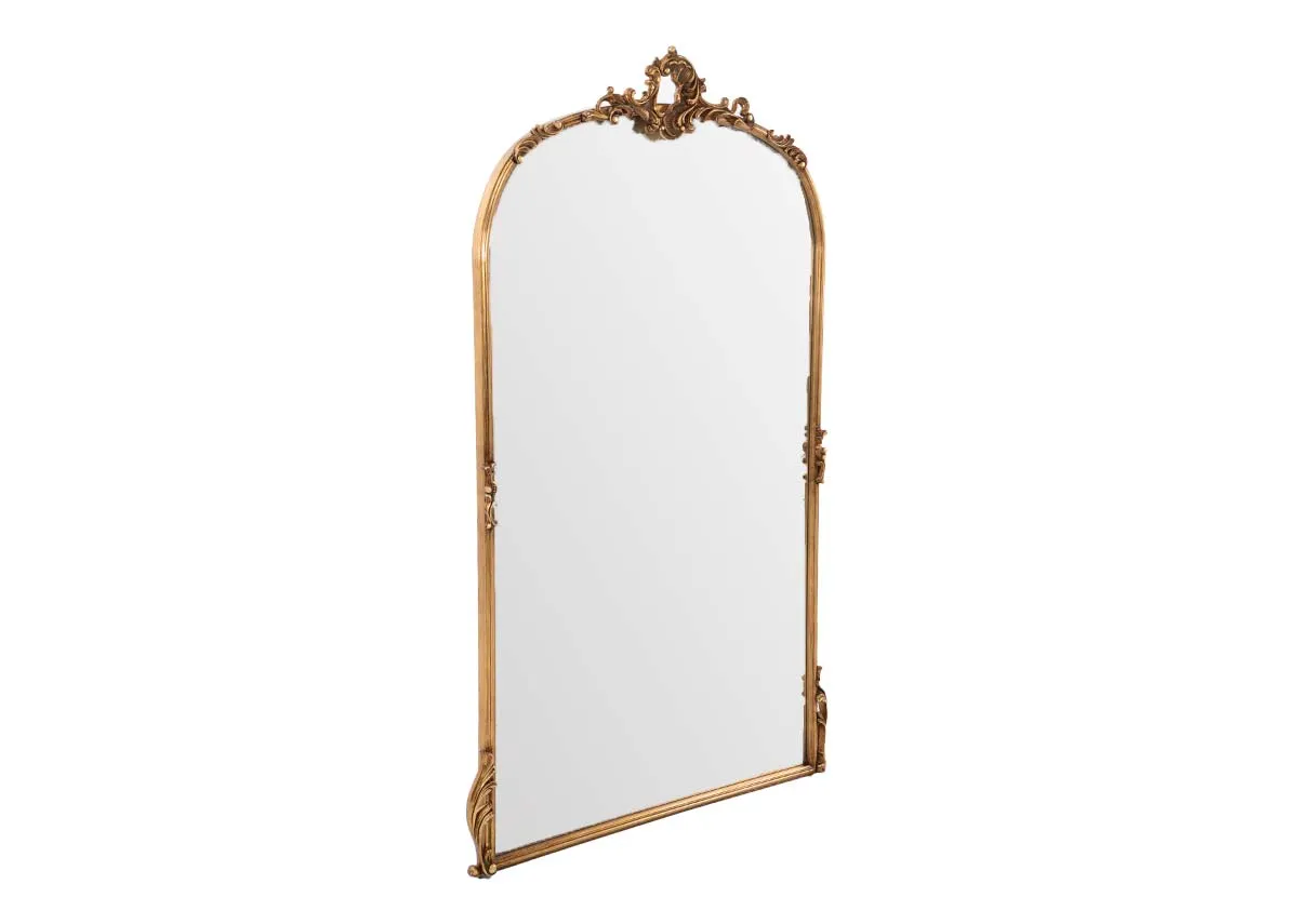 A large arched mirror with ornate gold trim from EZ Livings Kacey range.Angled view