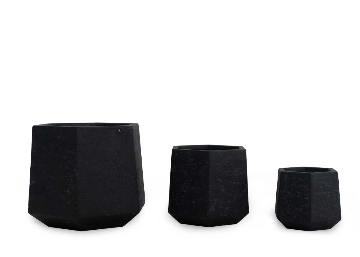 A set of 3 black clay planters from EZ Livings Ferrara range. Front view of 2 hexagonal shape planters