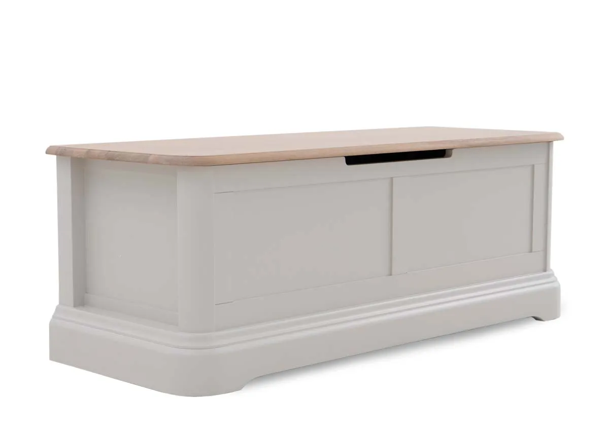 A grey wood blanket box from EZ Livings Kylemore range. Angled view of lid down shows oak top