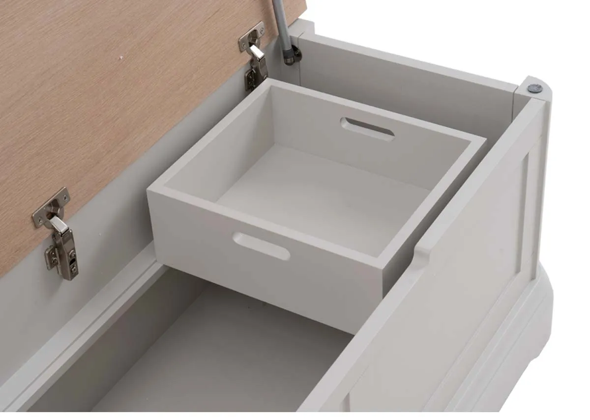 A grey wood blanket box from EZ Livings Kylemore range. Closeup of hinged under lid and storage including a small inserted box
