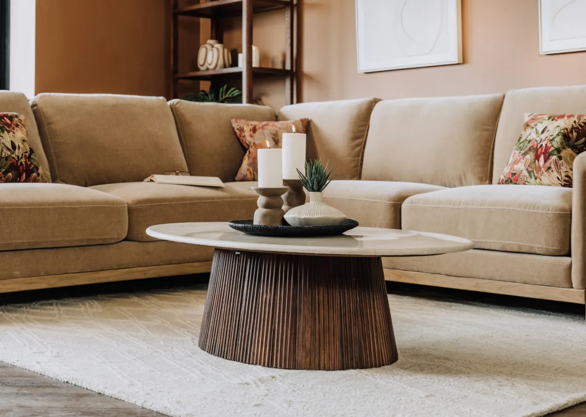 A lifestyle image of the Kira coffee table with Miller corner sofa and Gateway canvas.