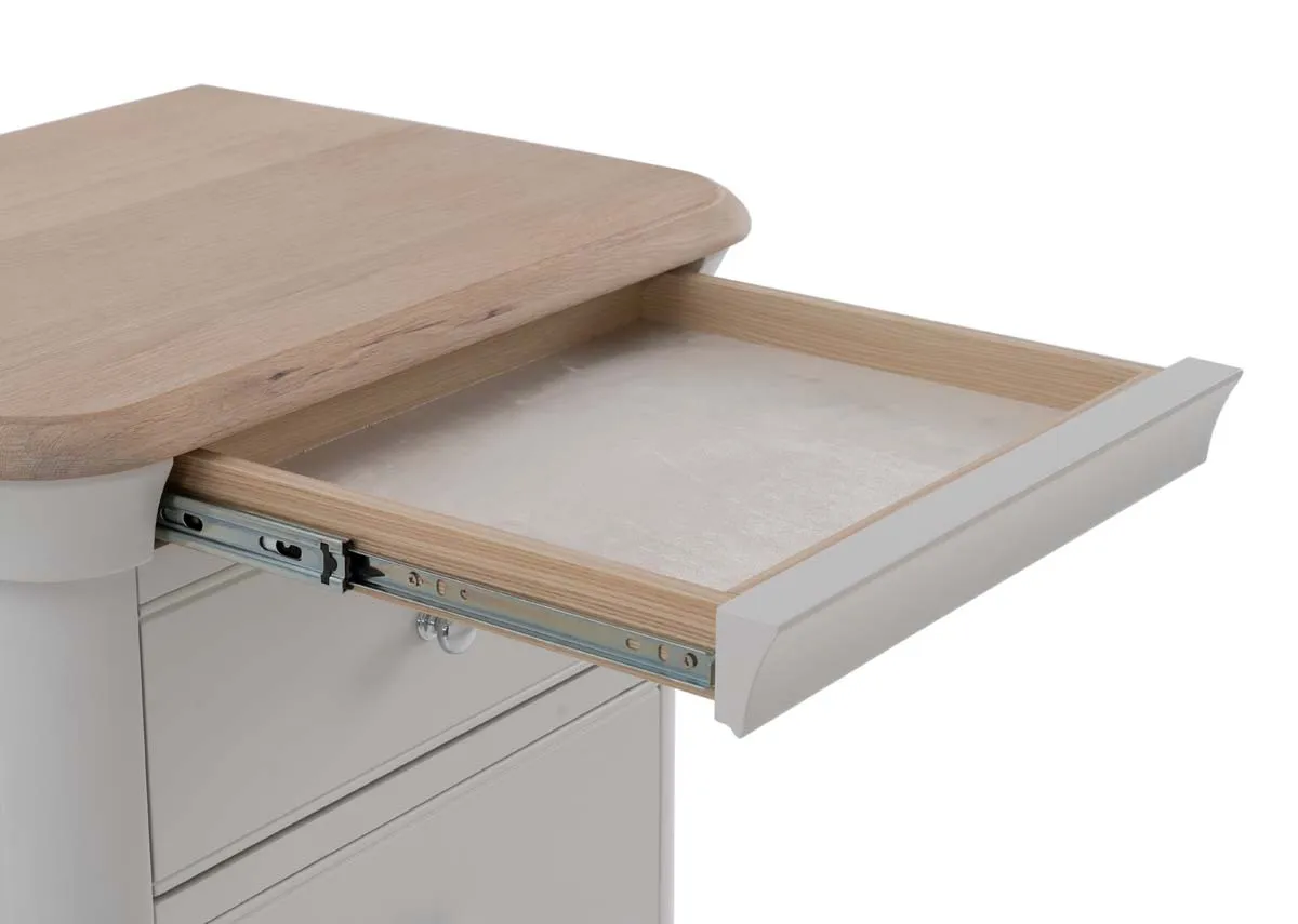 A grey tallboy chest from EZ Livings Kylemore range with top hidden shelf open for cup or phone.