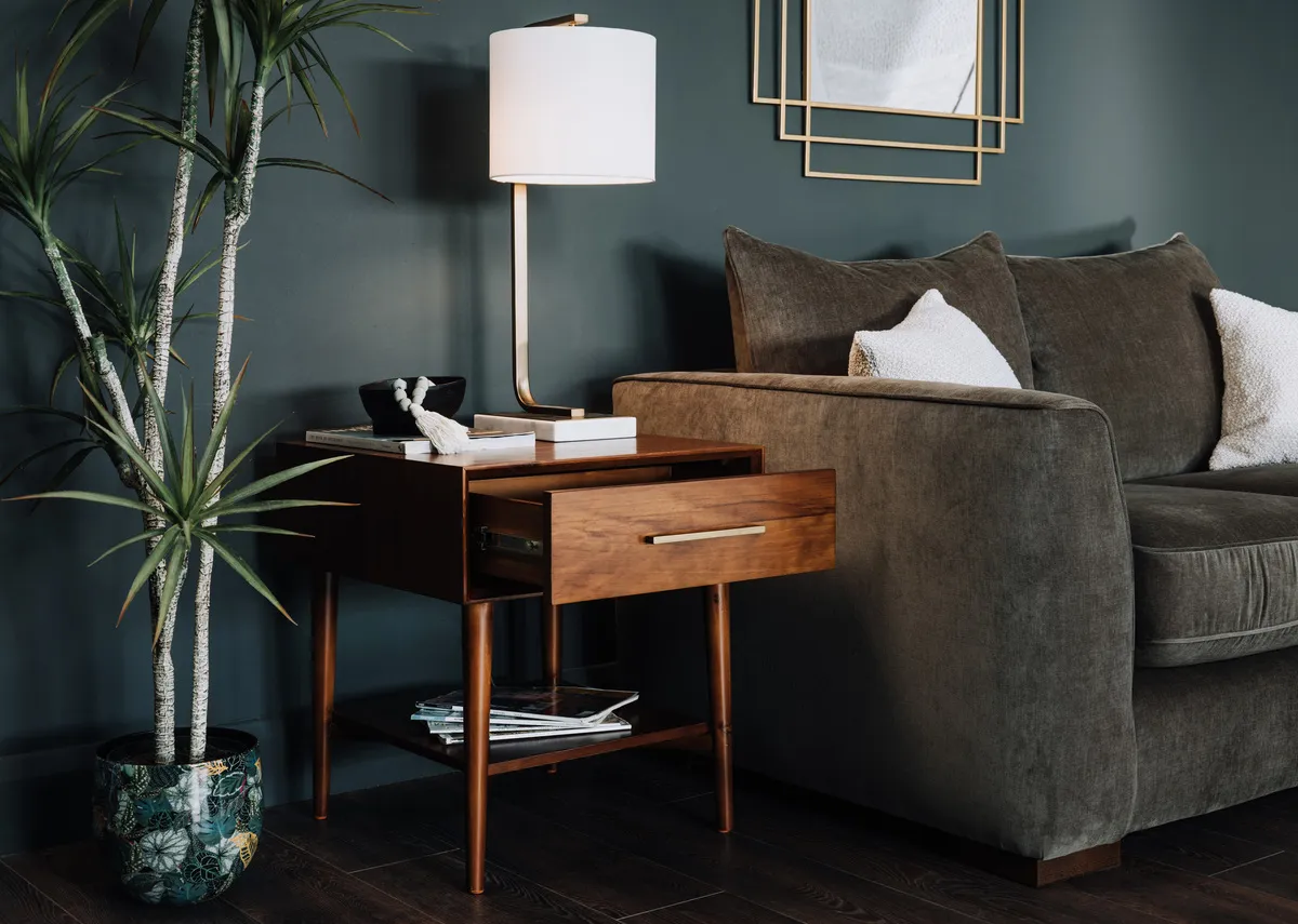A lifestyle image of the Leya lamp table with Emme planter