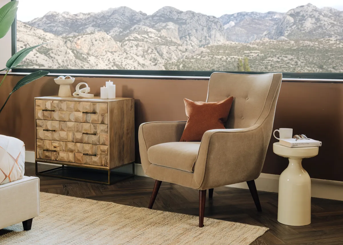 A lifestyle image of the Stratus chair with Alora side table and Diva chest