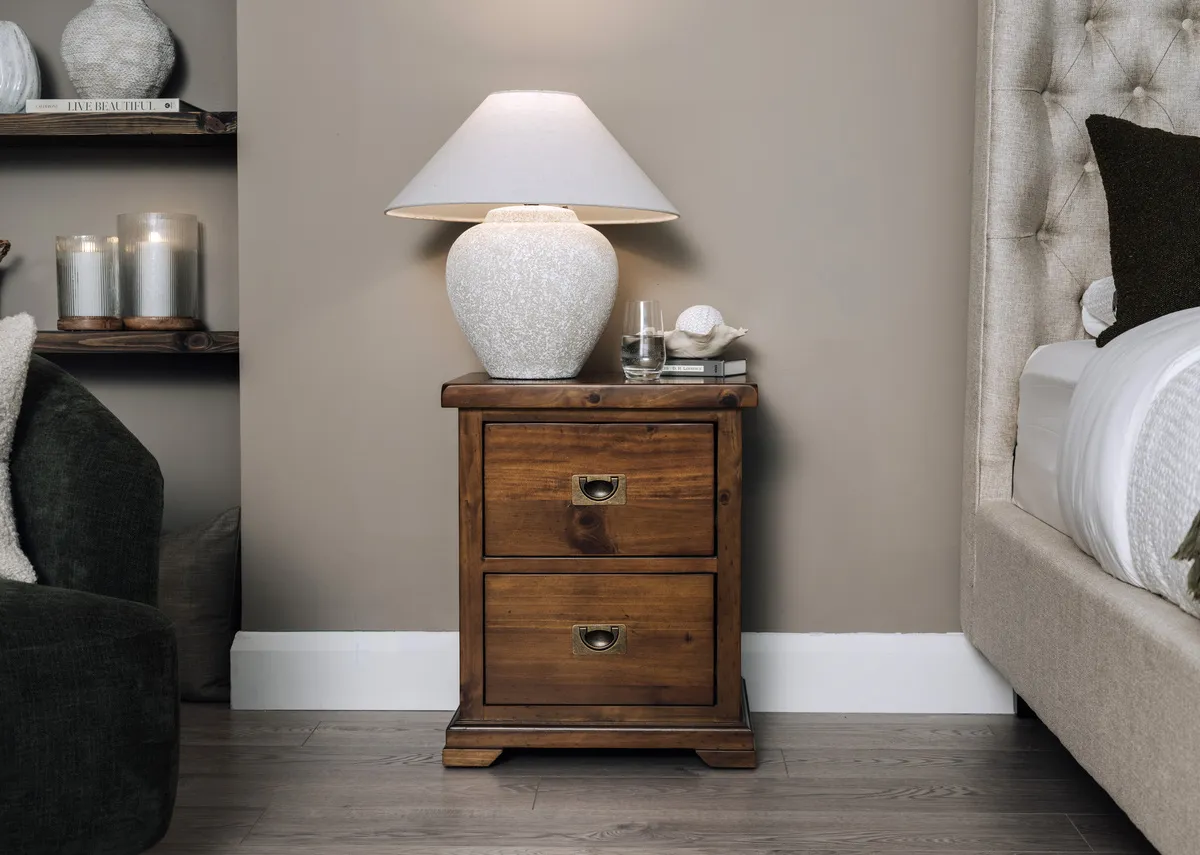 A lifestyle image of the Hannah corner sofa with Moyola lamp on the sideboard