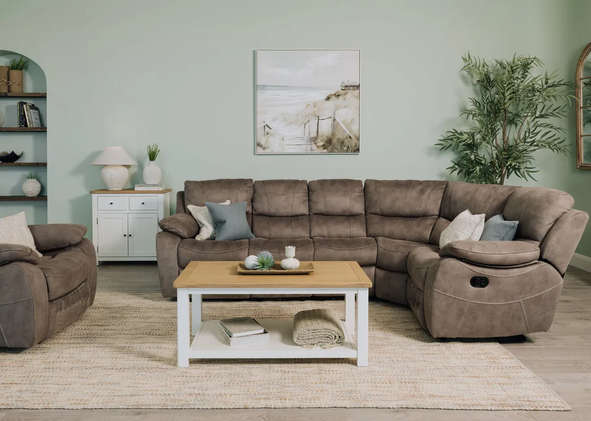 A lifestyle image of the Hannah corner sofa with Moyola lamp on the sideboard