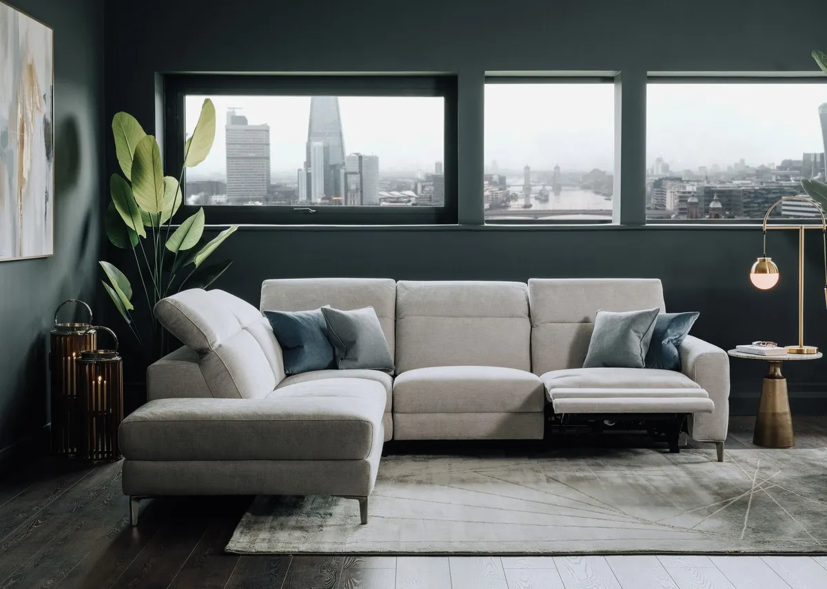 A lifestyle image of the Vancouver LHF chaise with avery rug and sonoma black tables