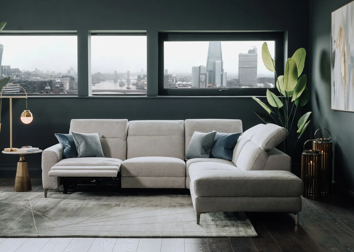 A lifestyle image of the Vancouver corner sofa with armchair reclined.