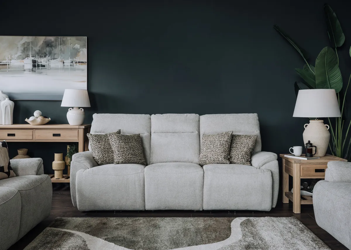 A 3 seater silver fabric recliner sofa from Ez livings Mallow range. Closeup of drinks holder in armrest