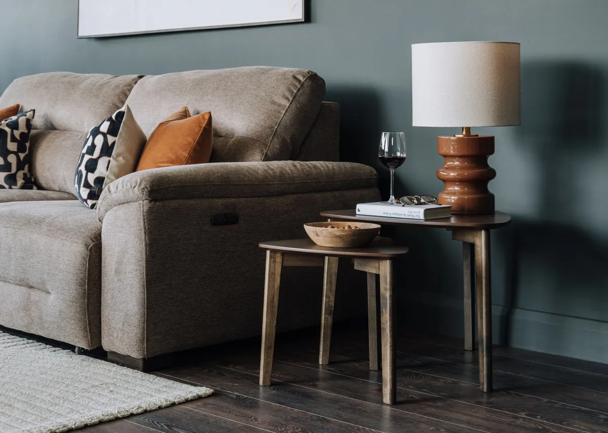 A lifestyle image of the Emmie lamp with Annalee sofa and pyramid tables