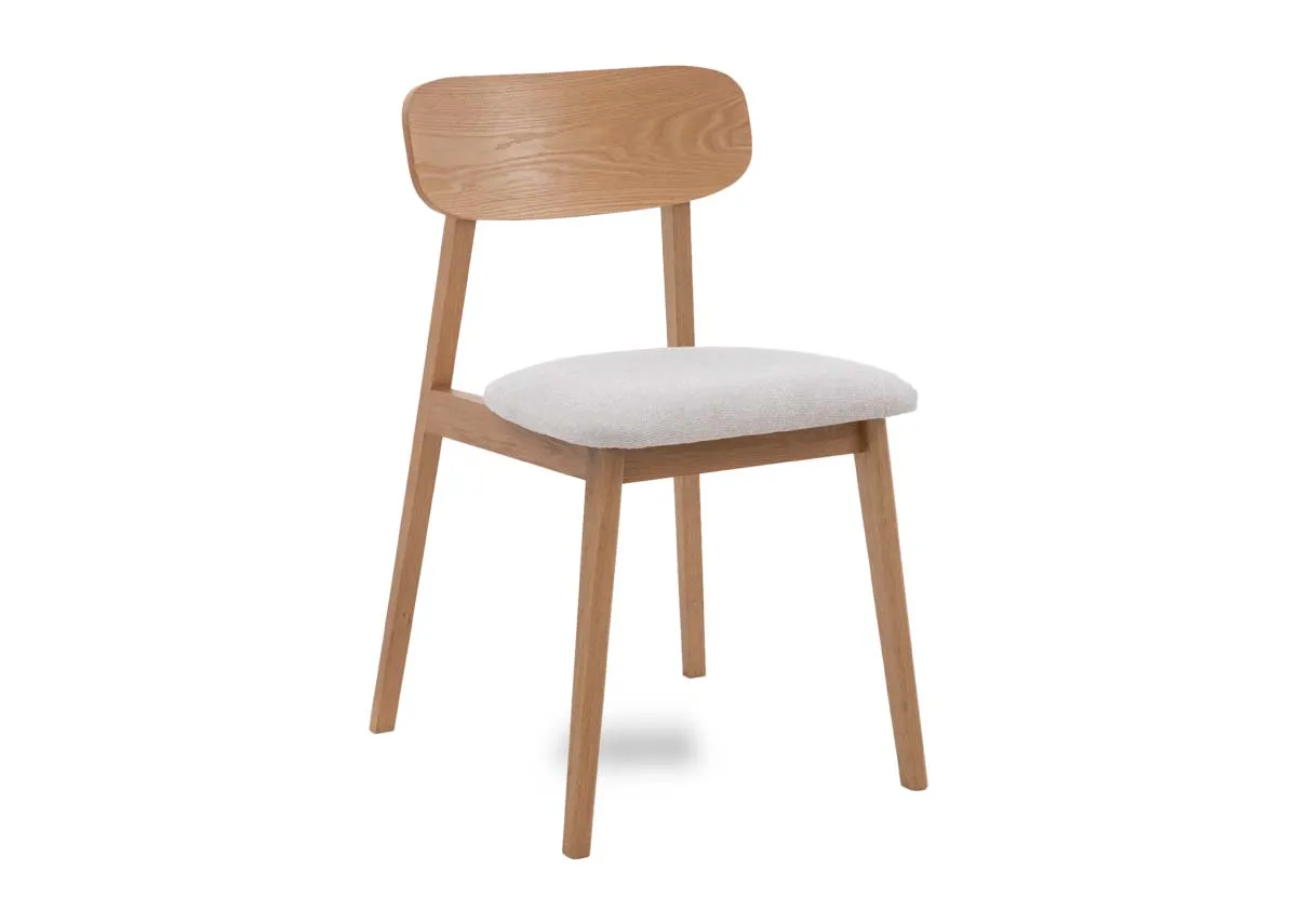 An oak dining chair with fabric seat from EZ Livings Hudson range. Angled view