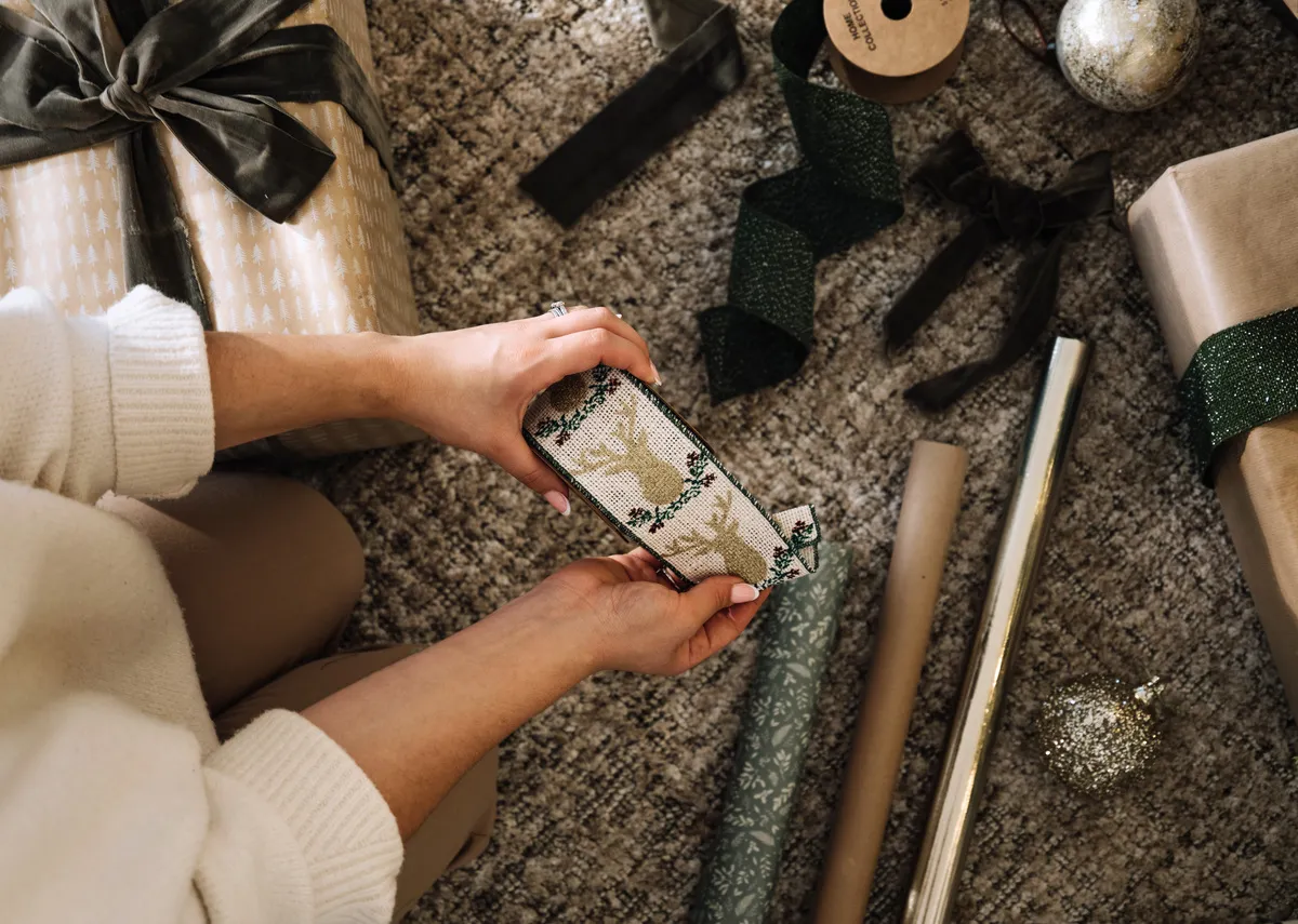 A lifestyle image of the Vintage ribbon roll with reindeers 