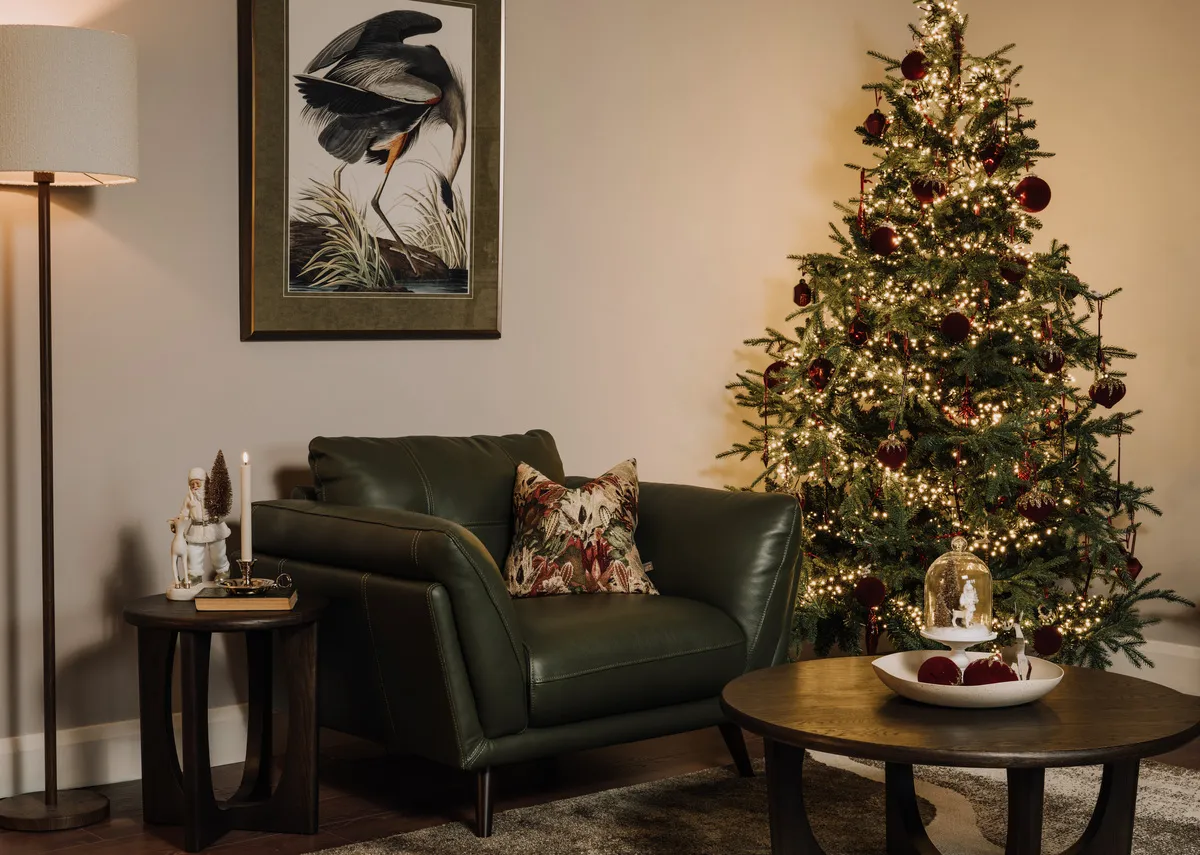 A lifestyle image of the Toscan armchair with Aspen christmas tree