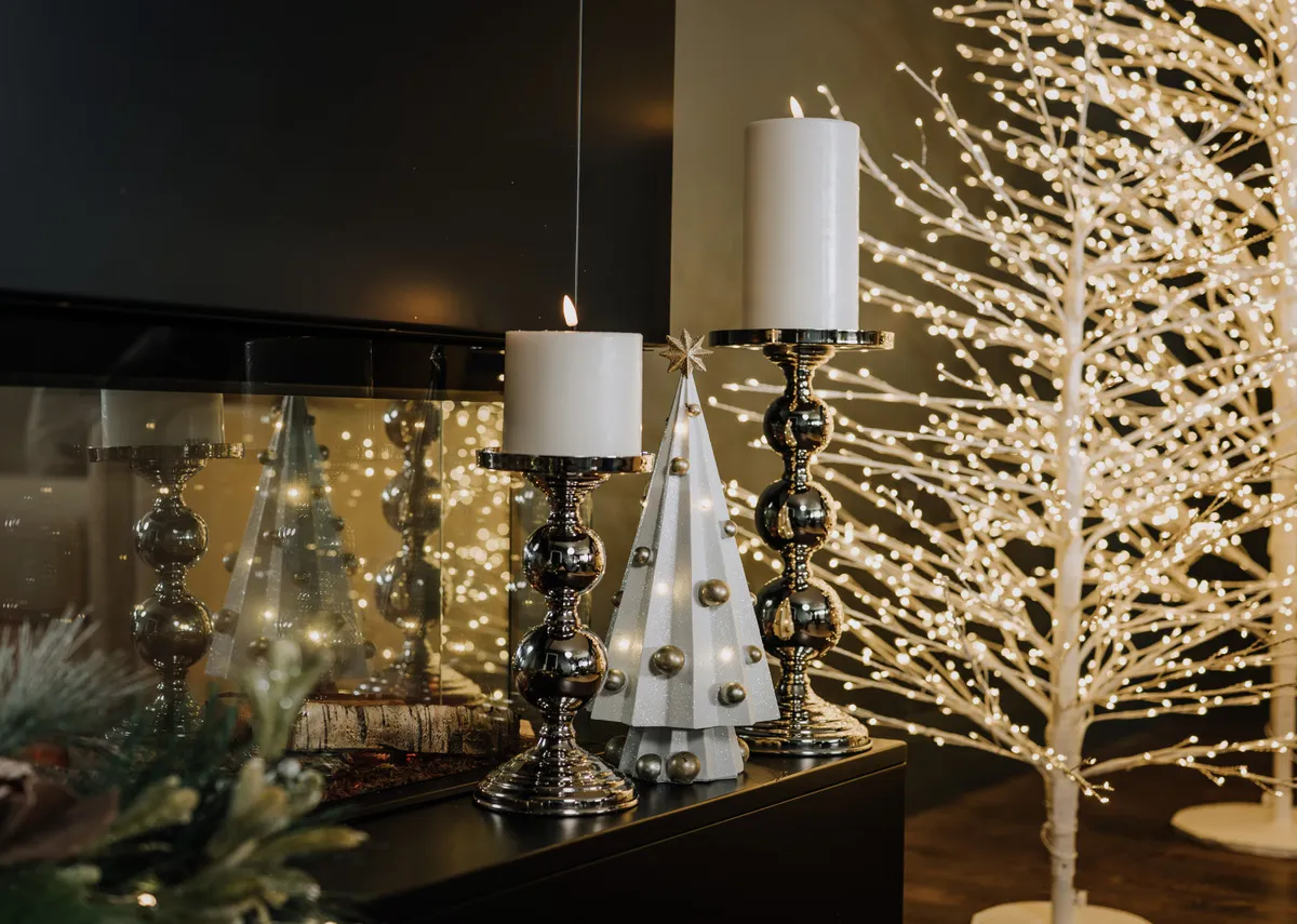 A lifestyle image of the LED tree in small with Steel Pillars and Rudy tree.