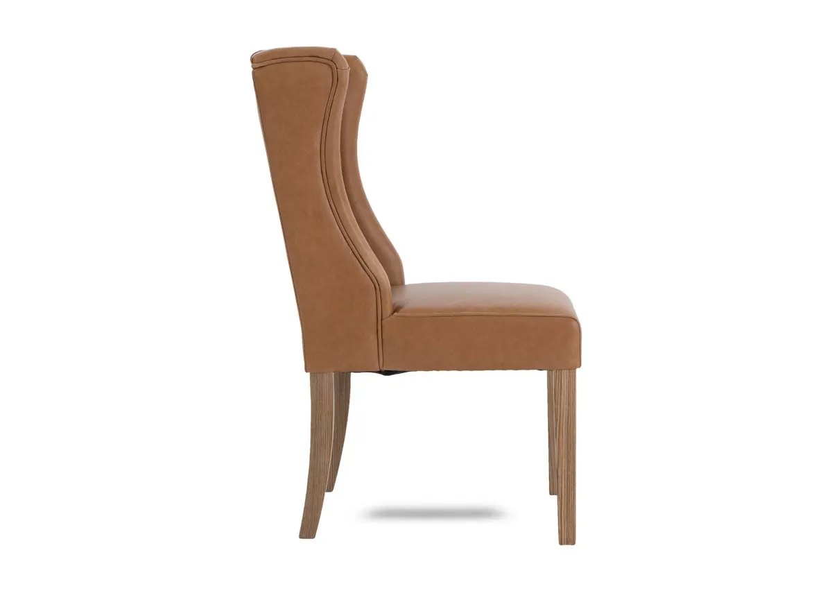 A tan leather dining carver chair from EZ Livings Naxos range. Side  view of curved edges