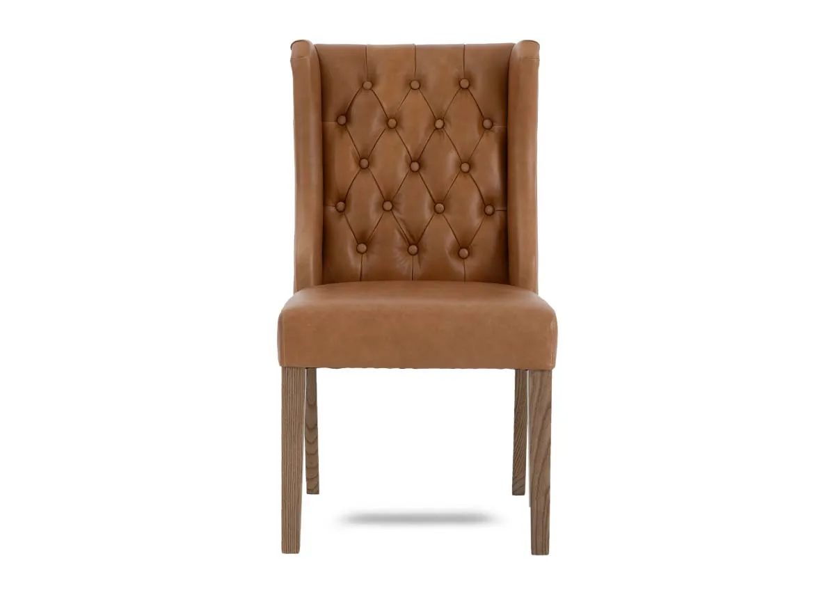A tan leather dining carver chair from EZ Livings Naxos range. Front voew of tufted button back