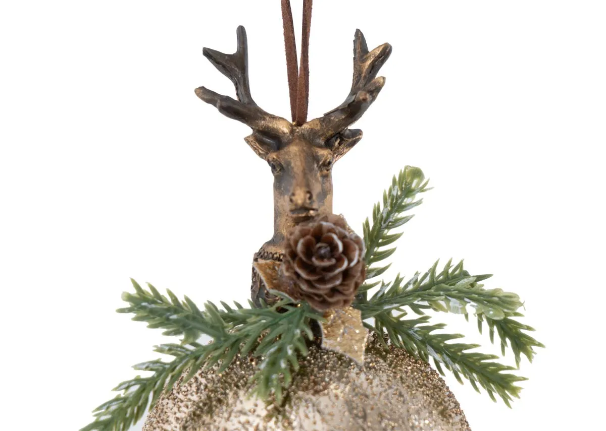 A close up of the deer head pinecone and green foliage on top of a gold glittered bauble ornament.
