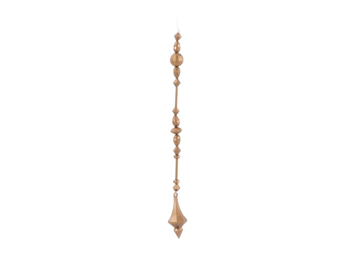 A brass diamond garland featuring a string of textured faceted brass beads in various shapes leading to a diamond shaped finial.