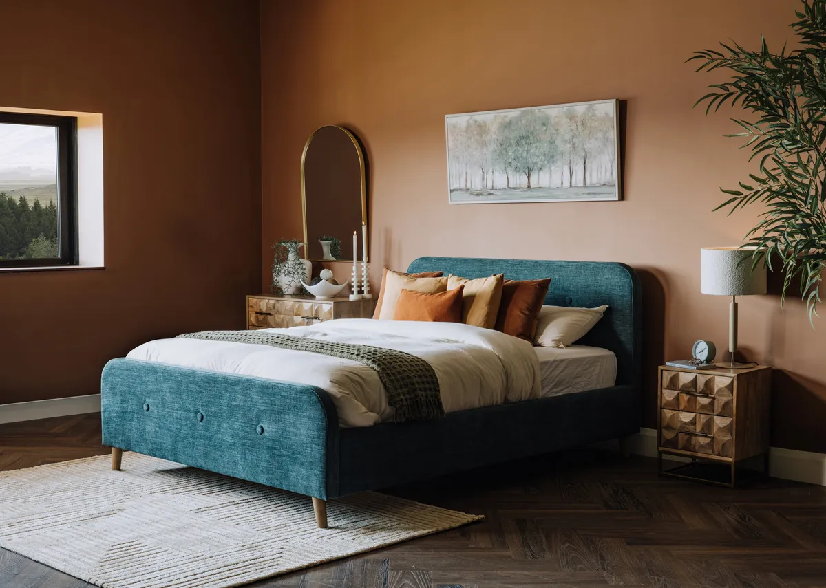 A lifestyle image of the Serena teal bedframe with Milton rug and Daydream canvas with Diva locker.