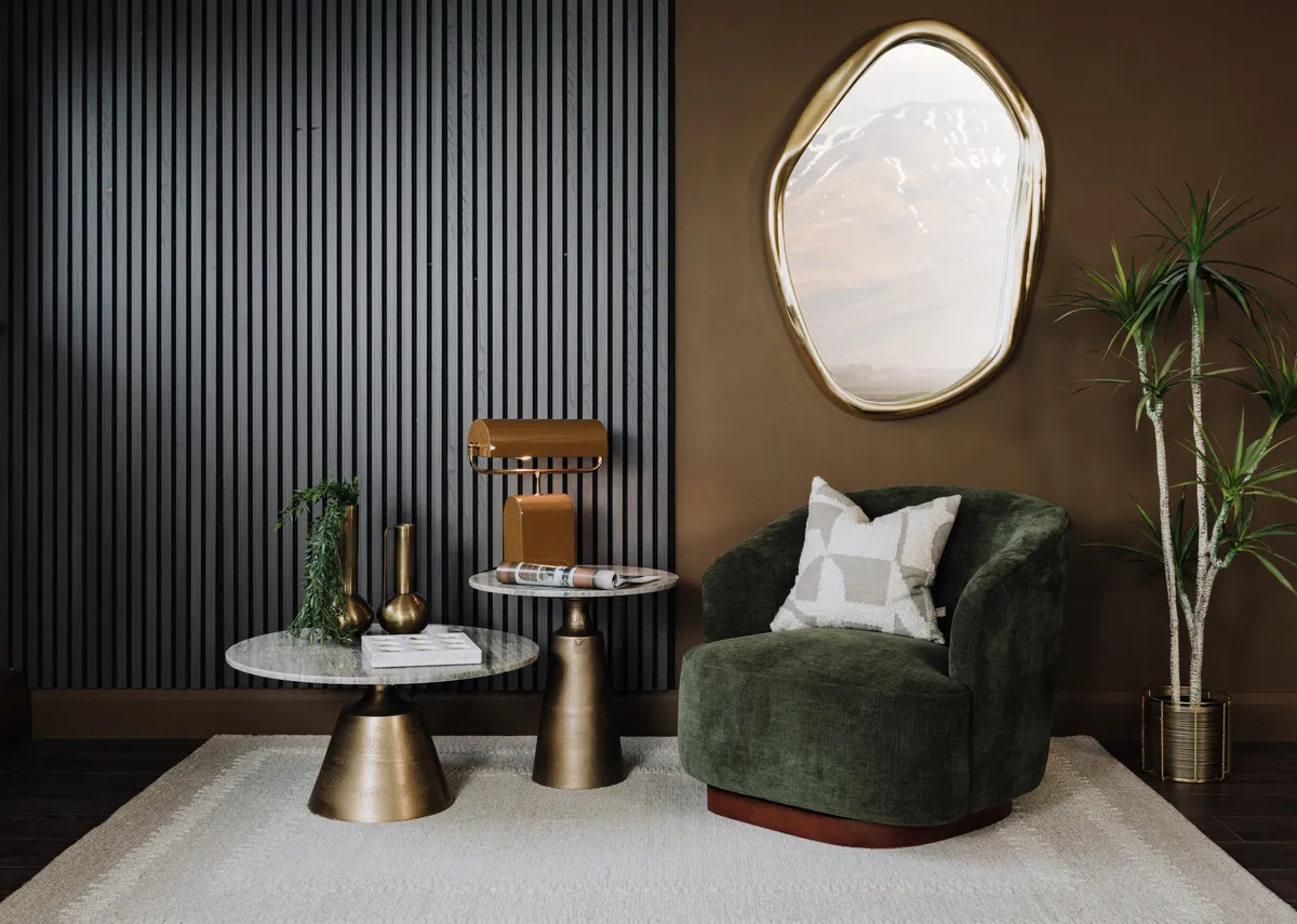 A lifestyle image of the Danica swivel with pyramid table and sovata rug.