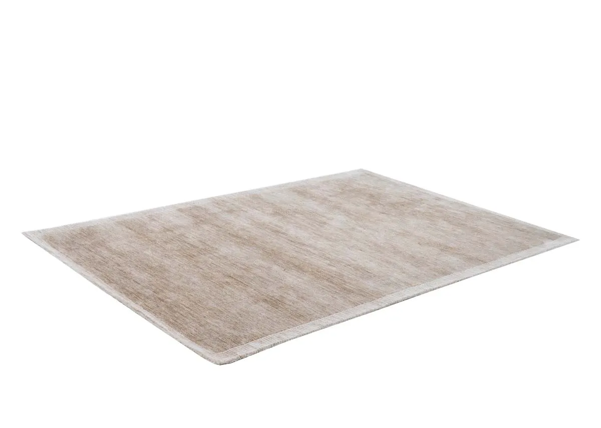 A rectangular rug in a light sandy beige colour featuring subtle horizontal textured lines viewed from an upper angle.