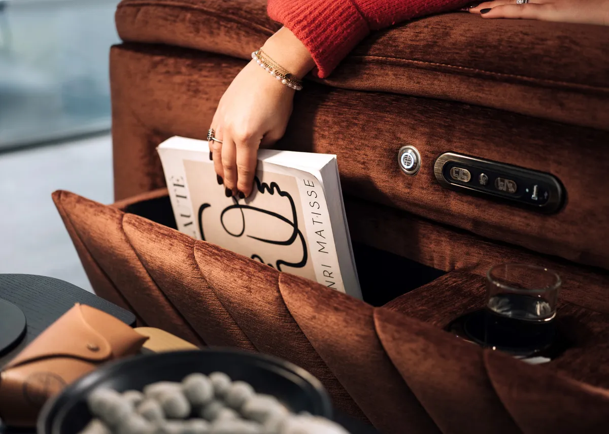 A rust fabric power recliner from EZ Livings Paige Range. Closeup of p