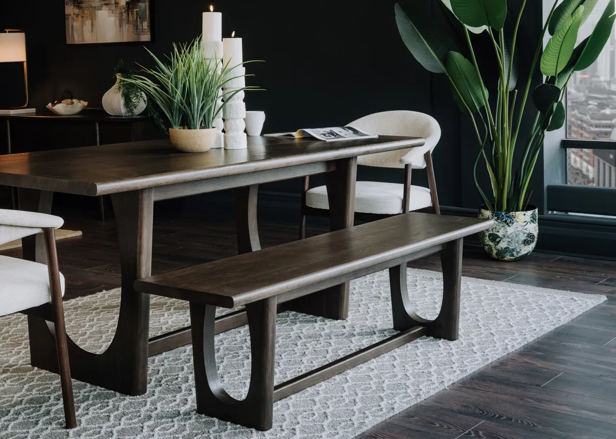 A lifestyle image of the Flow Espresso bench with the extendable dining table